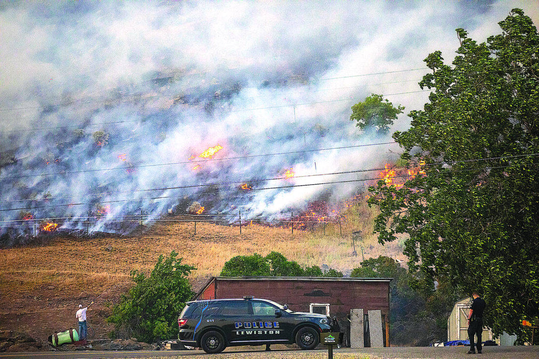 Thousands evacuated as Canadian wildfires threaten air quality into ...